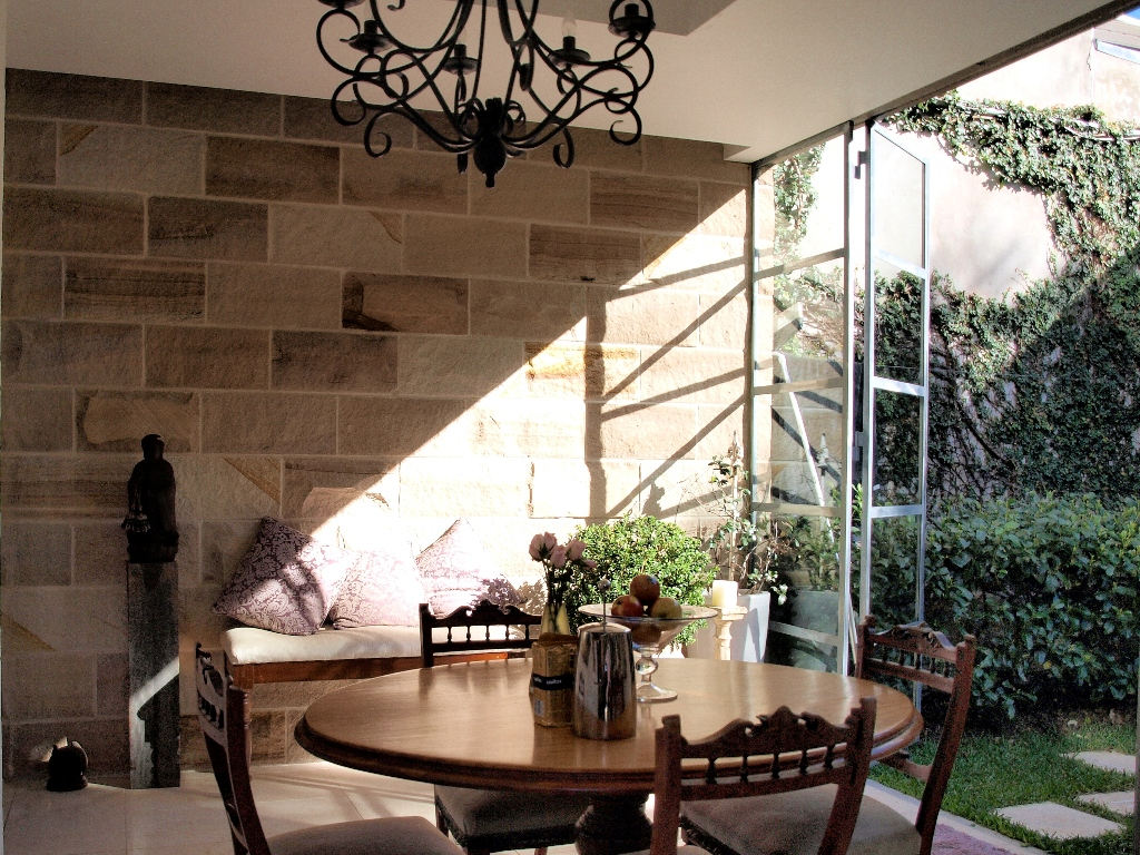 Dining room with stone wall feature